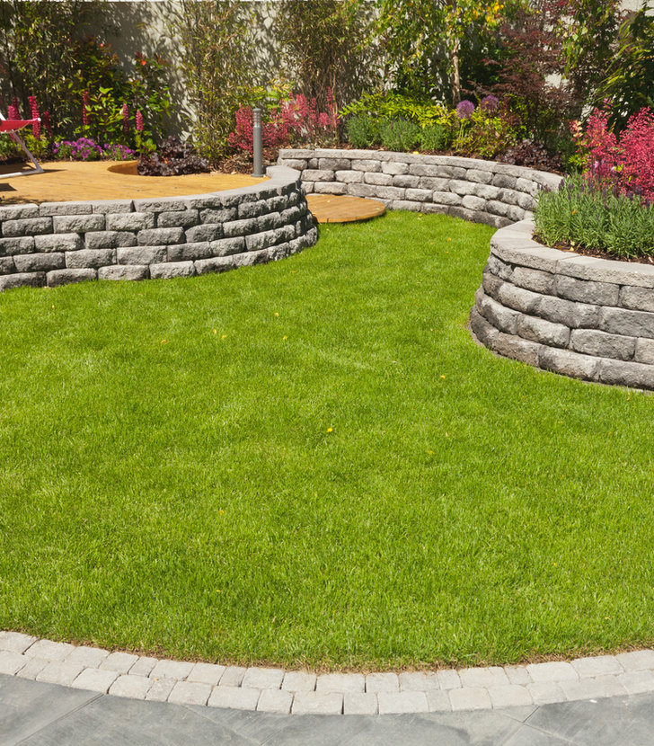 Professional landscaping with stone wall