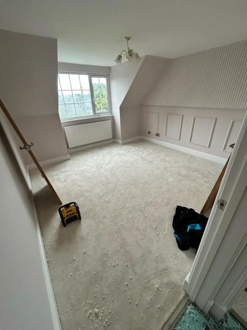 Completed master bedroom with angled ceiling panelling by JRD Construction