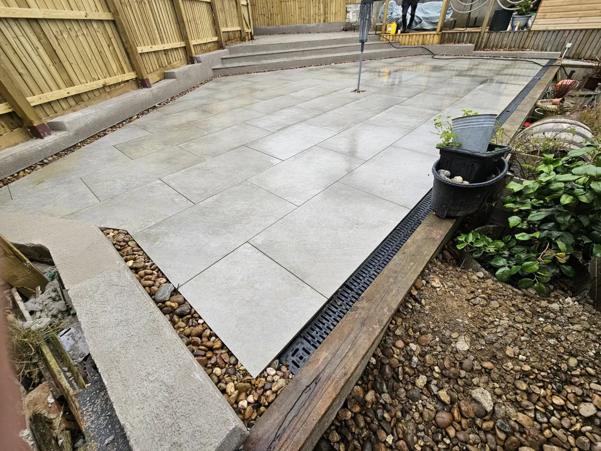 Completed porcelain patio with tiered steps in Porthcawl