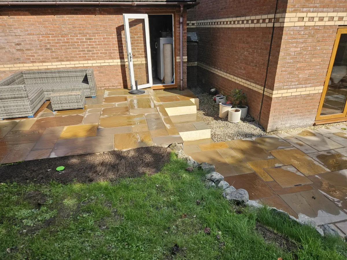 Completed Indian stone patio with garden furniture in Port Talbot